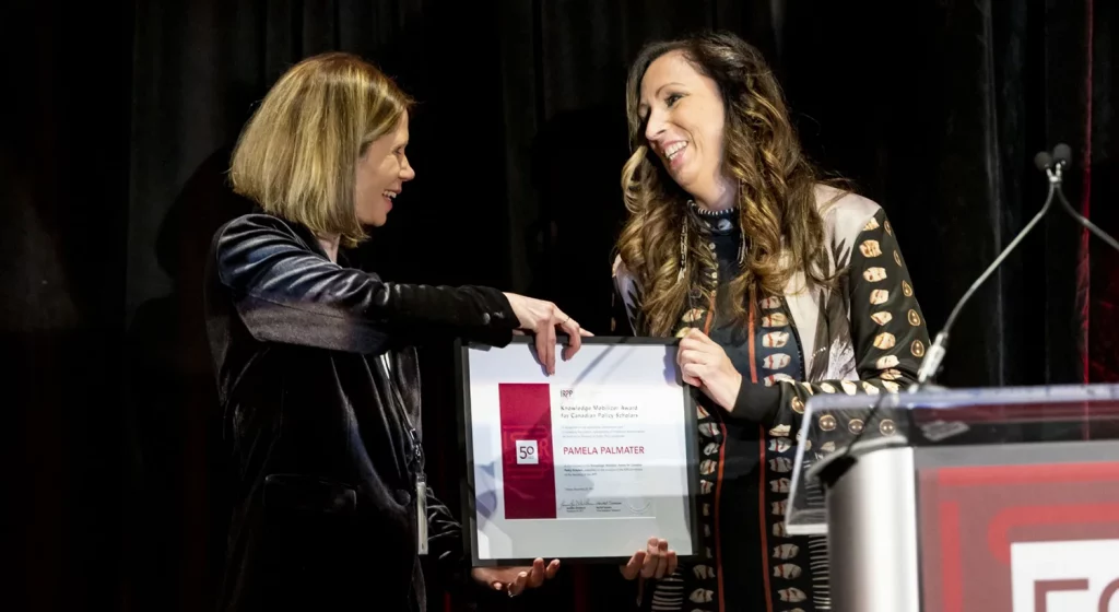 Pam receiving an award.